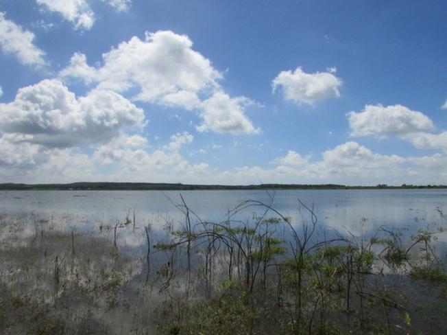 Sky clouds and blue water surface of Da Bang Lake